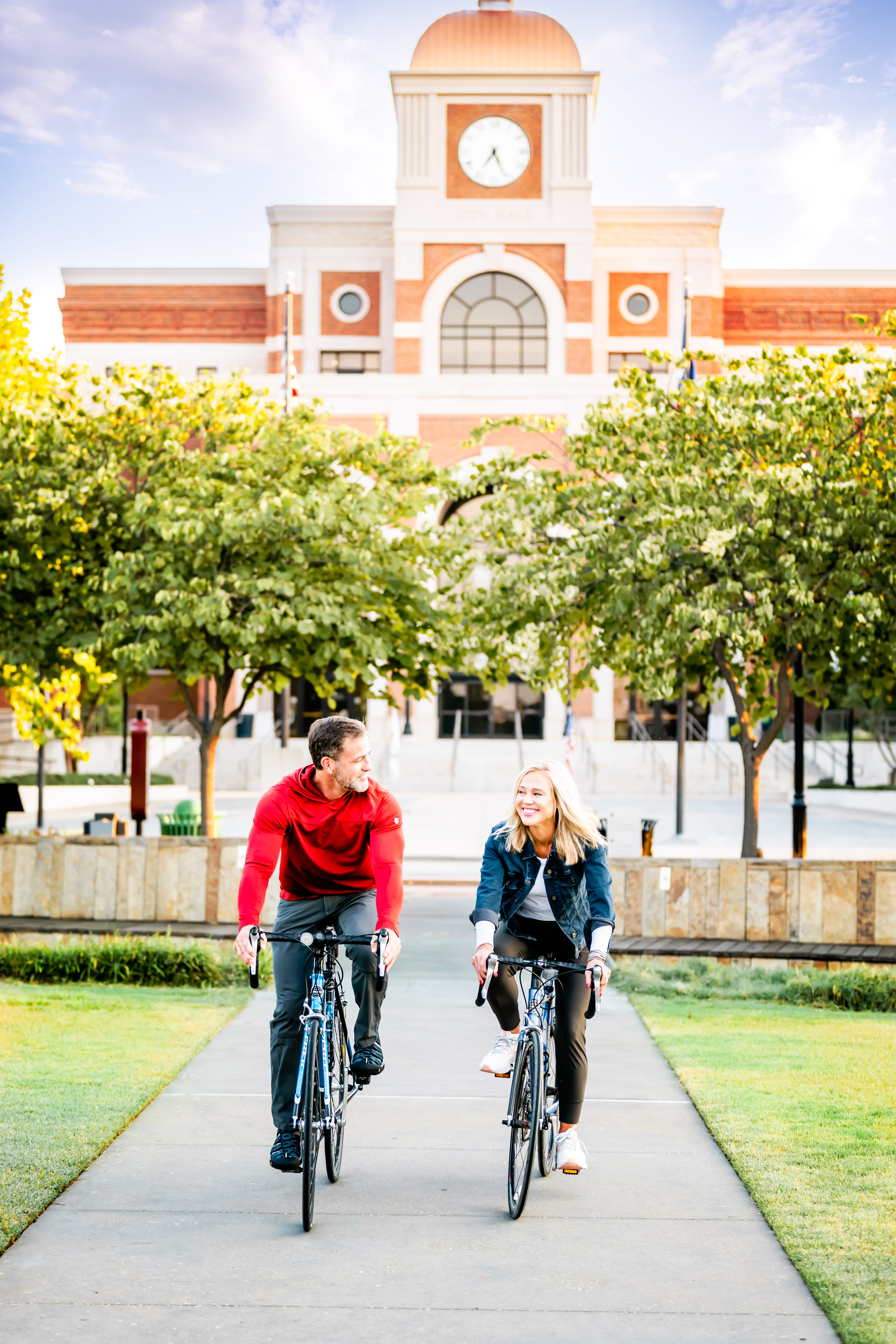 Couple Biking in front of City Hall